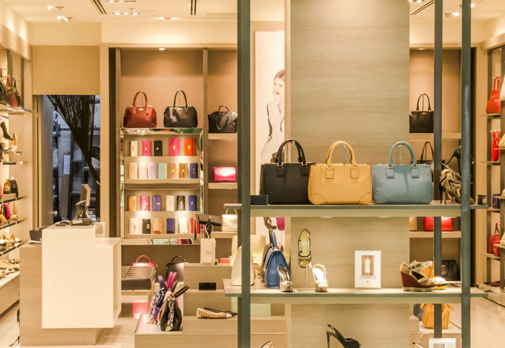 pexels-photo-135620-135620 Chic boutique with a variety of handbags and shoes elegantly displayed on shelves.