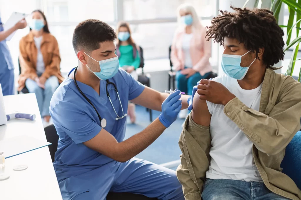 Participant receiving an injection during a supervised clinical trial study