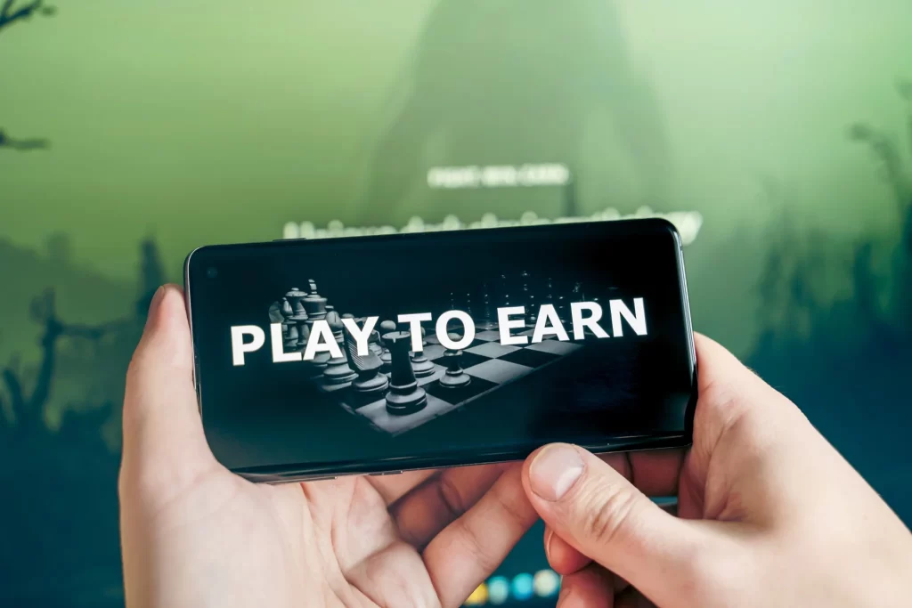 Smartphone displaying a play to earn game concept for paid to play games apps